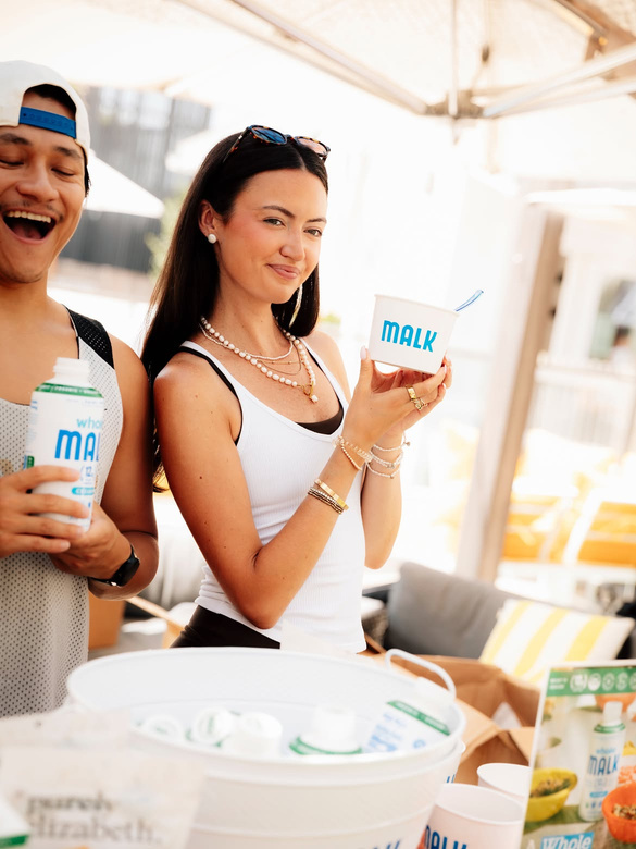 Guests trying a product at an outdoor brand event